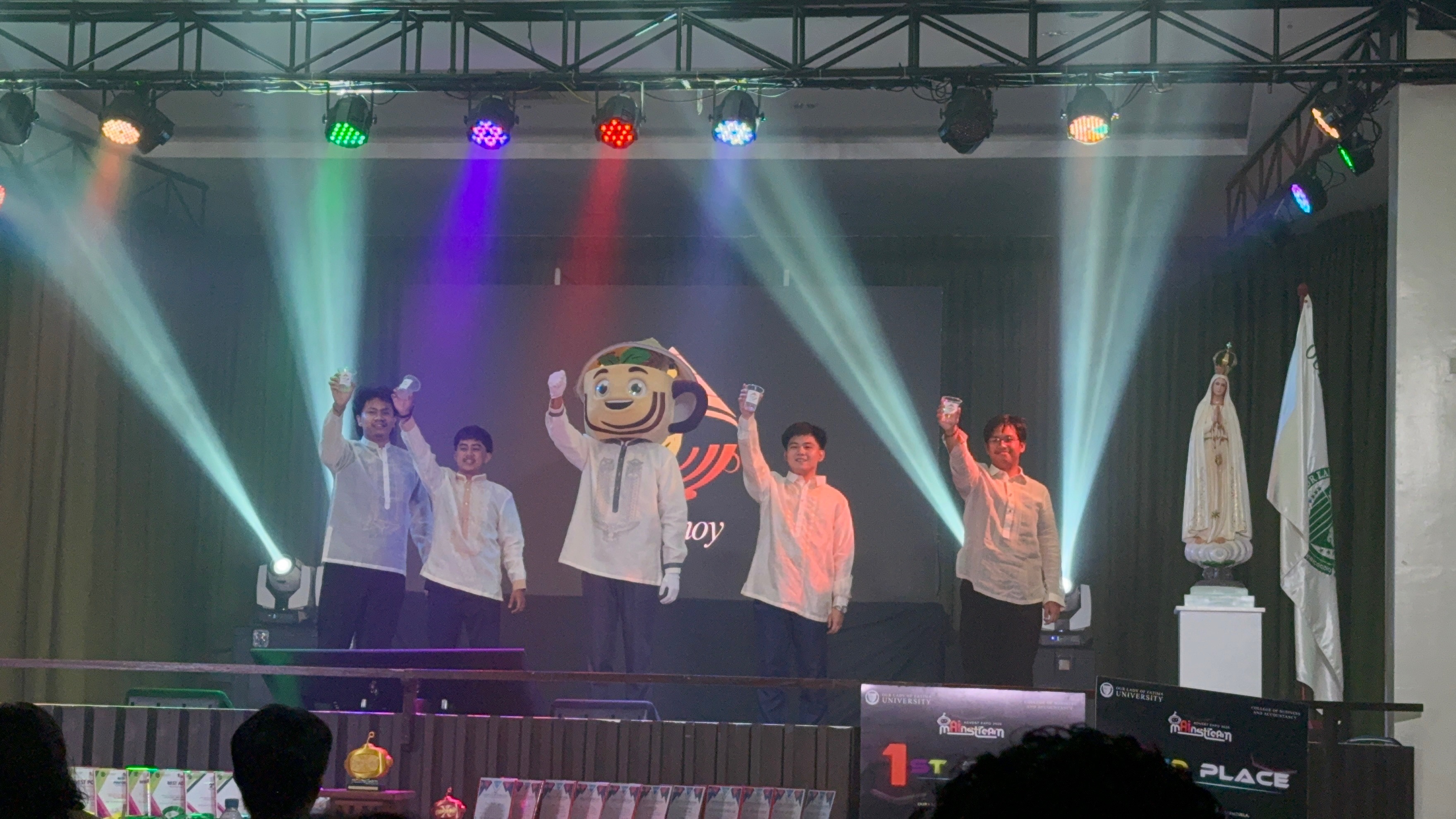 The Mainstream team and mascot on stage at Advert Expo 2026
